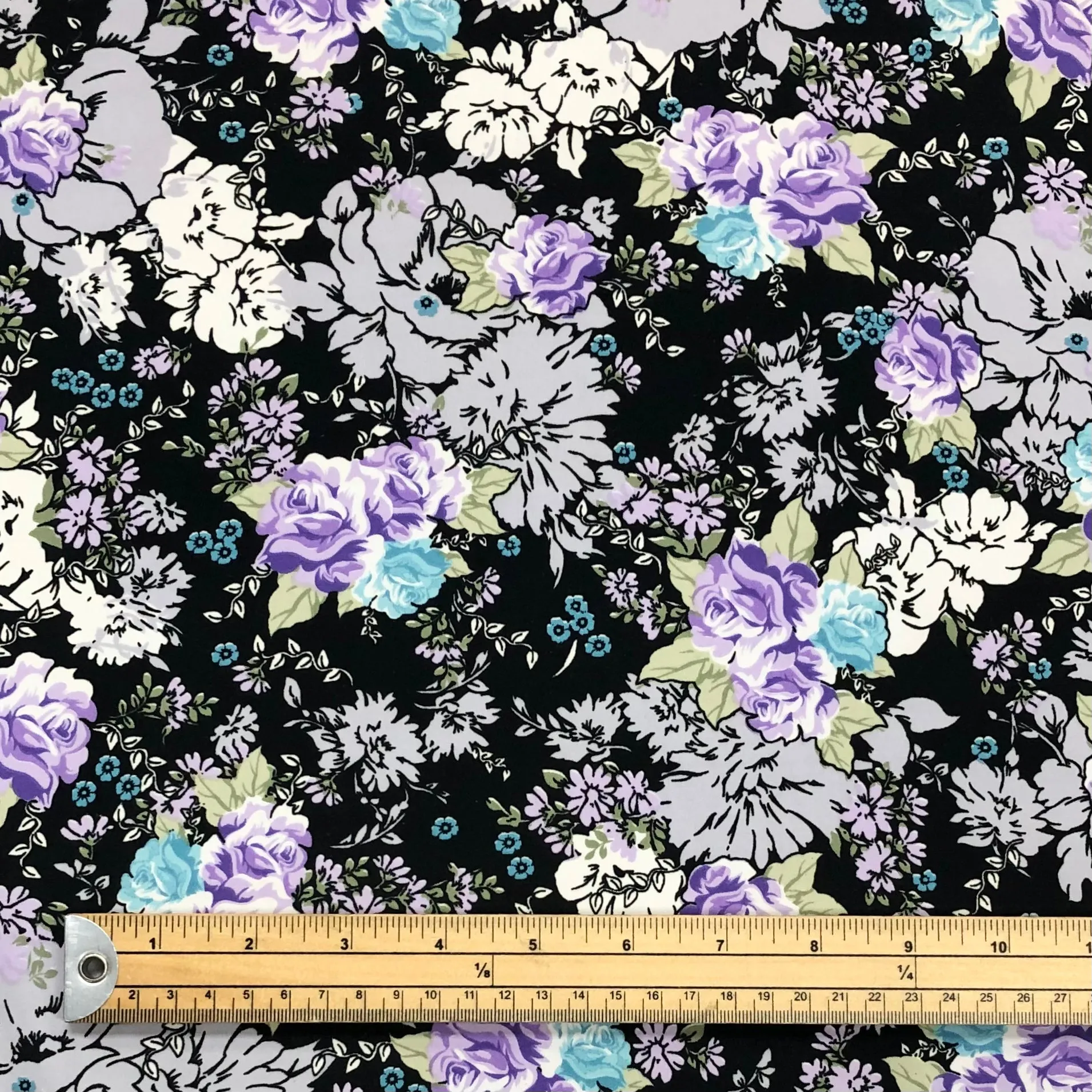 All Over Floral on Black Polyester Fabric